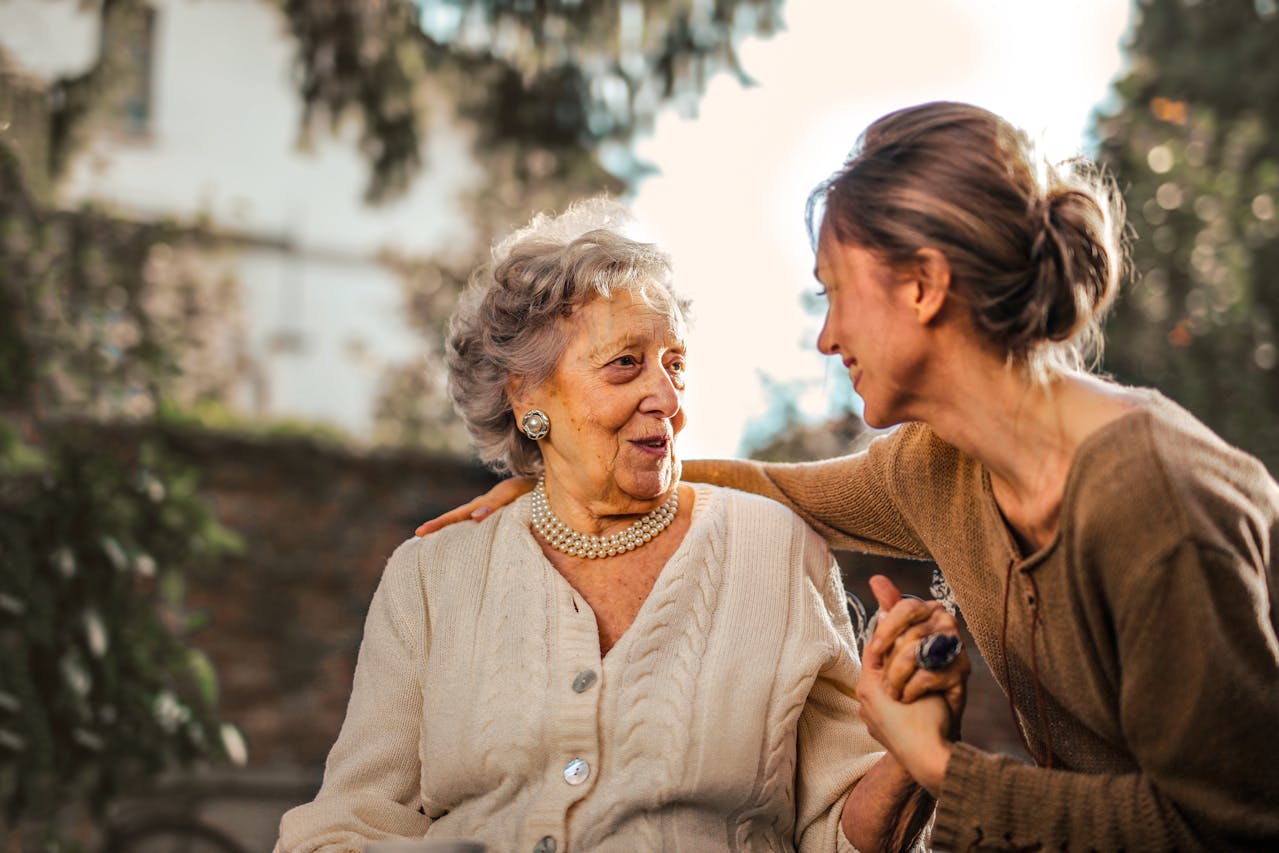 Mother and daughter talking and smiling