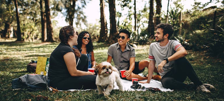 People sitting on the grass. 