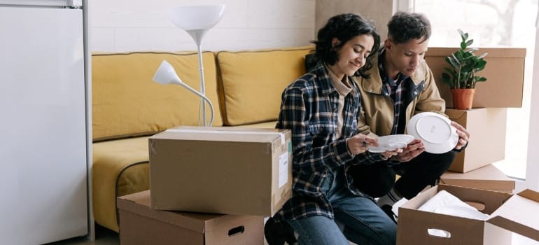 Picture of a couple unpacking boxes 