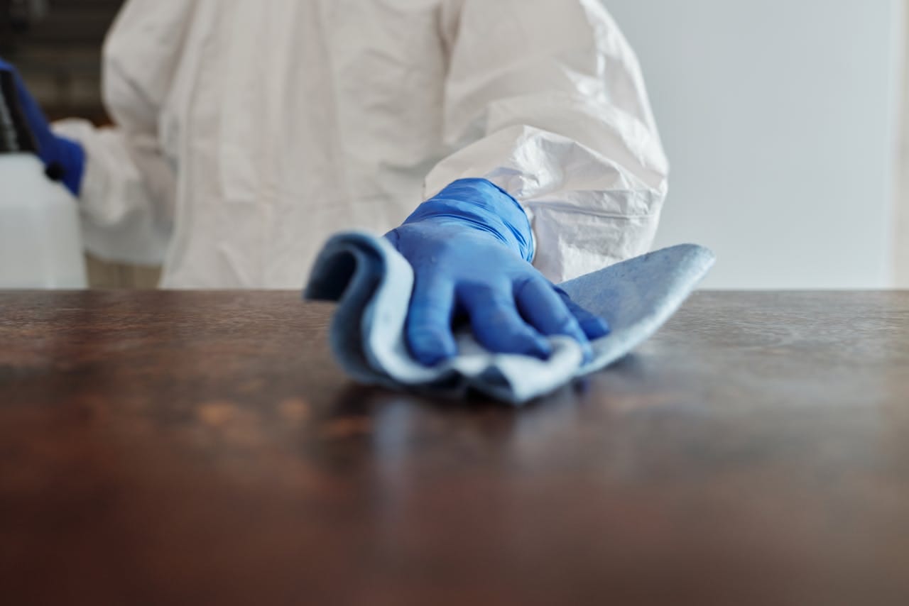 Picture of a person cleaning a surface