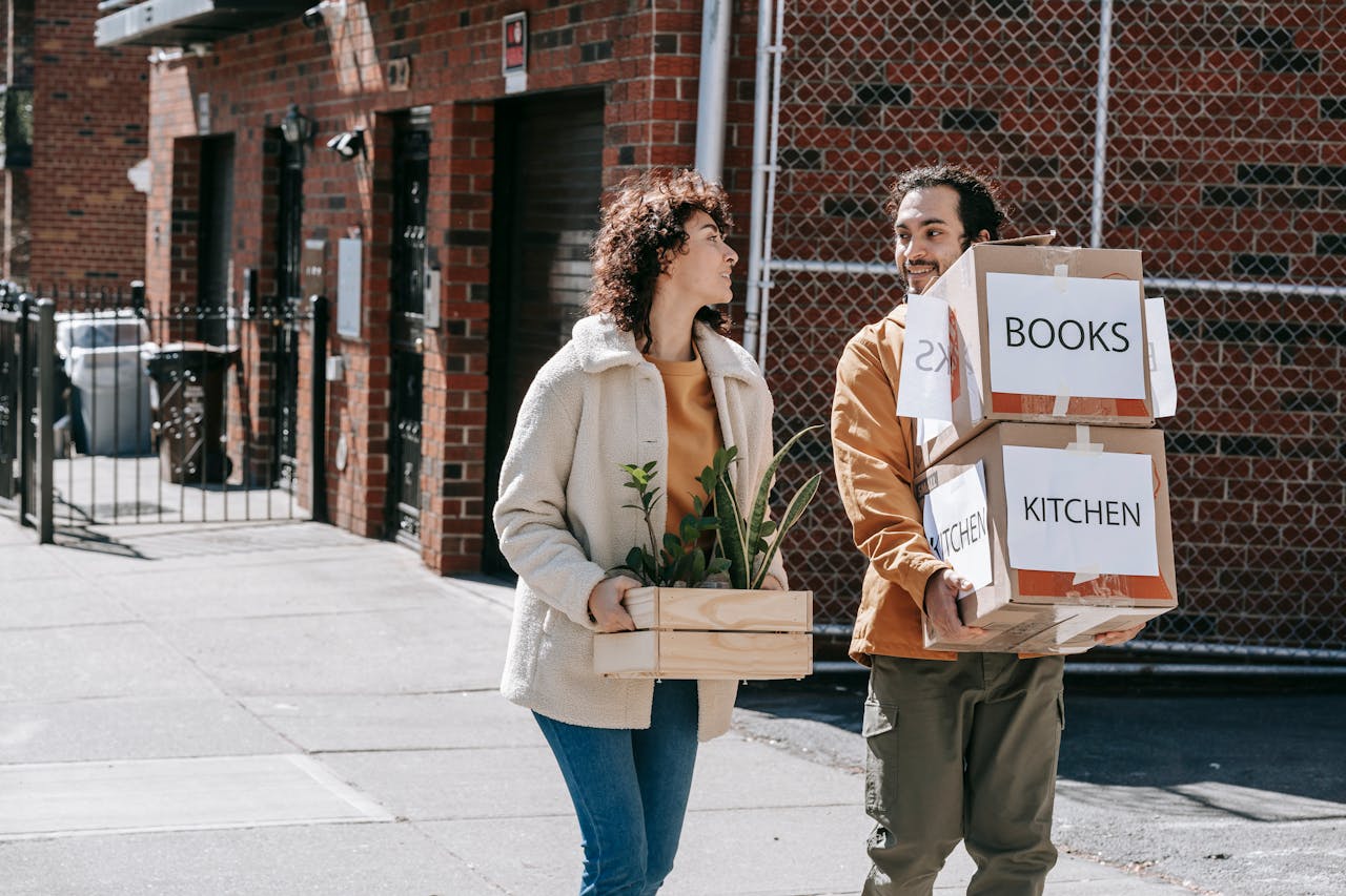 a couple helping after learning how to welcome your new neighbors in BC tips