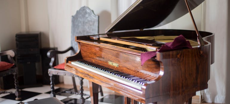brown wooden grand piano.