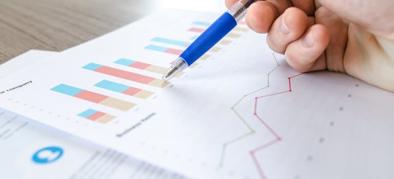 Person examining a graph.