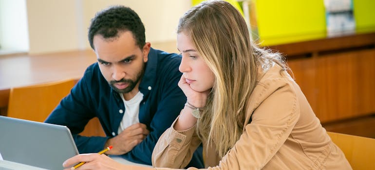 Couple researching whether to rent or buy home in British Columbia.