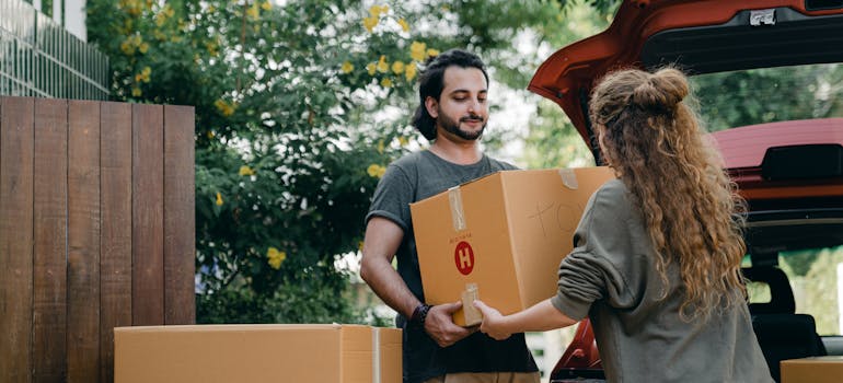 Man helping his neighbor with moving.