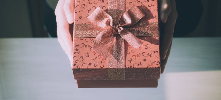 a pink gift box is the first step in learning how to welcome your neighbors in BC
