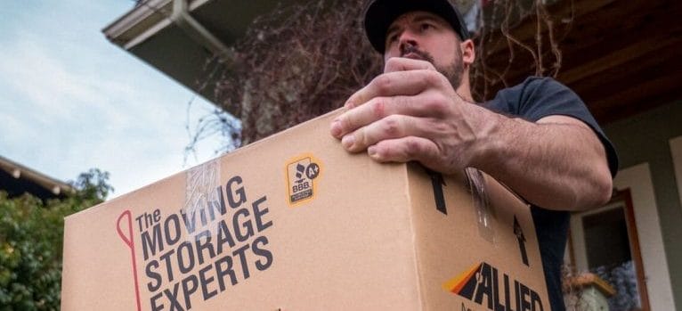 One of our small movers Victoria BC carrying a box
