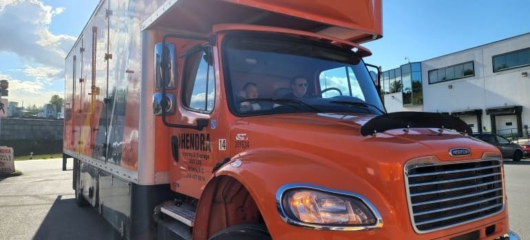 two Hendra professionals in a truck