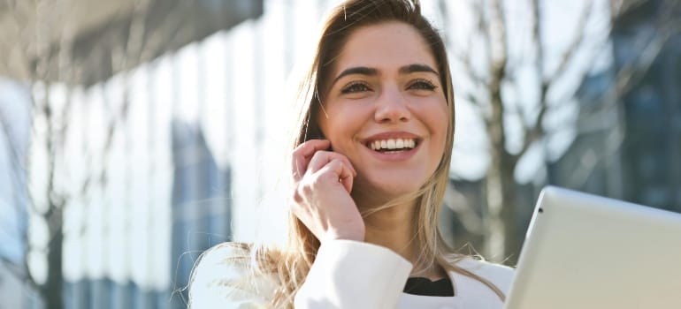 woman talking on the phone about Perks of living in Victoria vs. USA