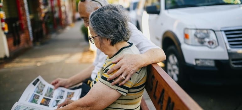 Couple reading about retirement in Colwood BC