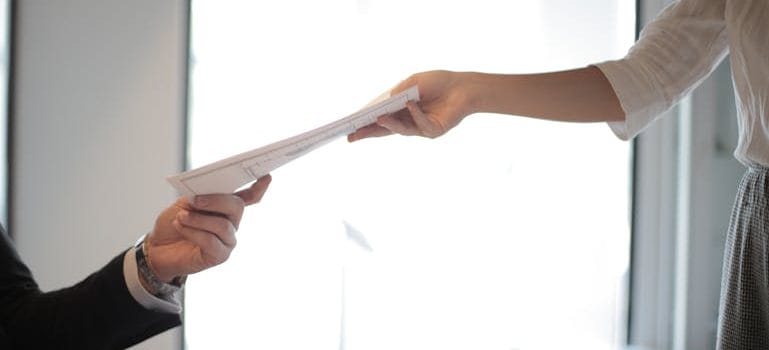 Job Applicant Passing Her Documents