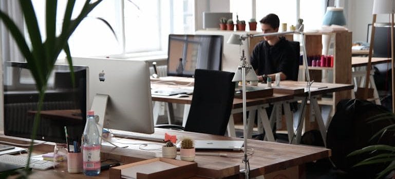 Man Sitting in Front of Computer