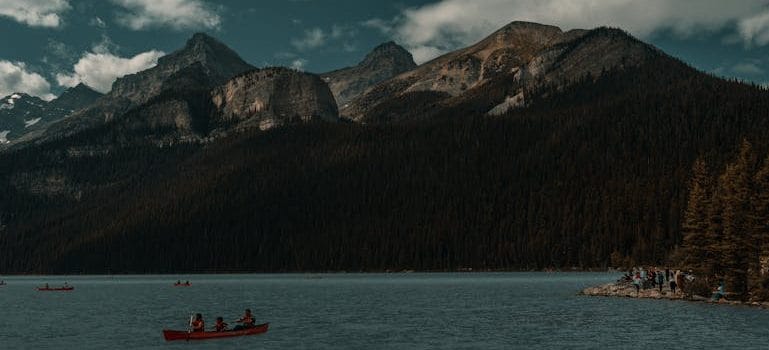 A group of people in a canoe on a lake
