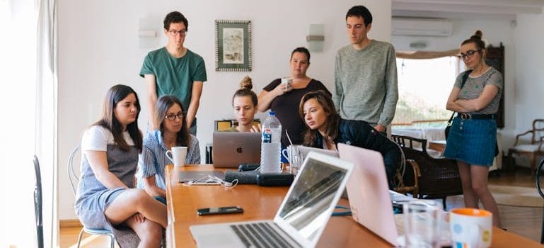 Group of People Watching on Laptop