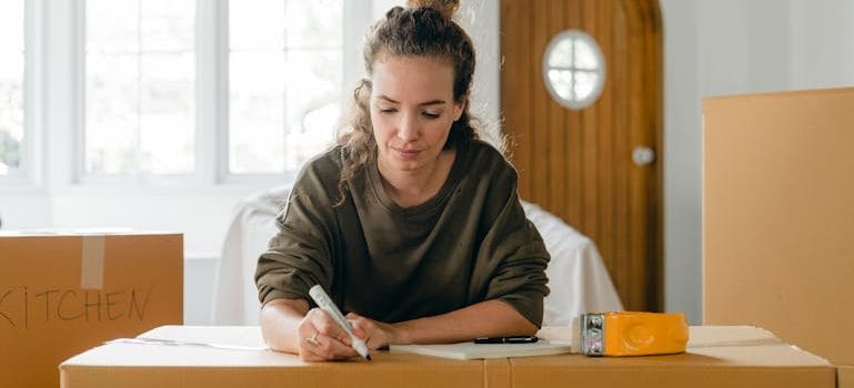 a girl reads How to Plan a Last-Minute Move Without the Stress