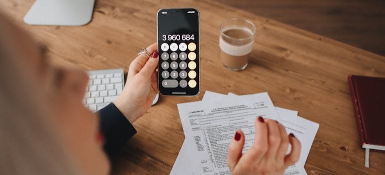 Person Holding using a Calculator