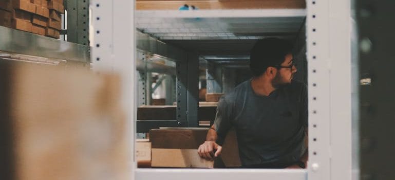 Man Under a Bunch of Large Shelves