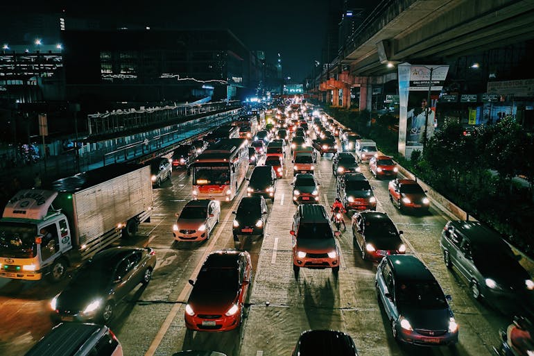 Vehicles On Road During Evening