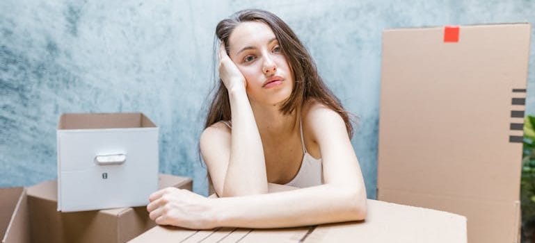 Woman Surrounded by Boxes