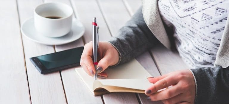 a woman writing about what movers wish you knew before your big day 