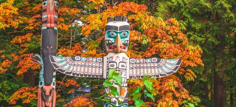 Colorful Totem Pole in Autumn Forest
