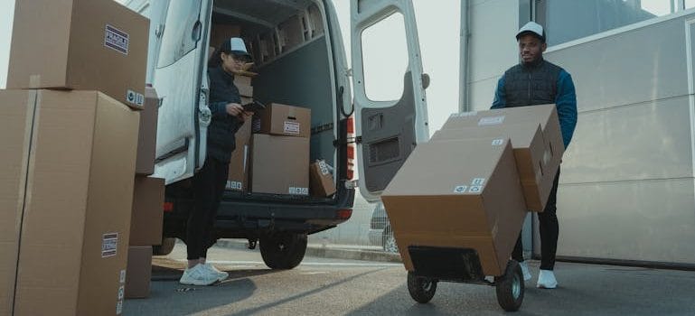 A Man and a Woman Working for a Delivery Company