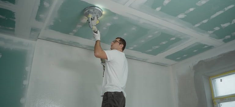 Man Polishing the Ceiling