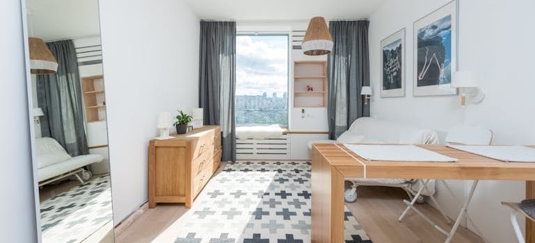 Wooden furniture in room with mirror