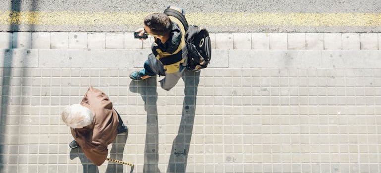 High-angle Photography of Two Person Walking Beside Road