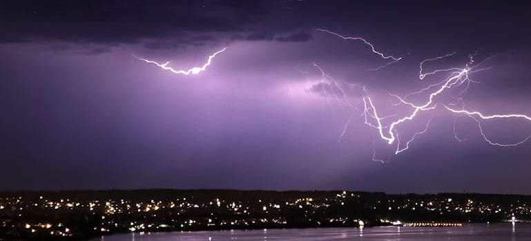 Lightning over Body of Water during Night Time