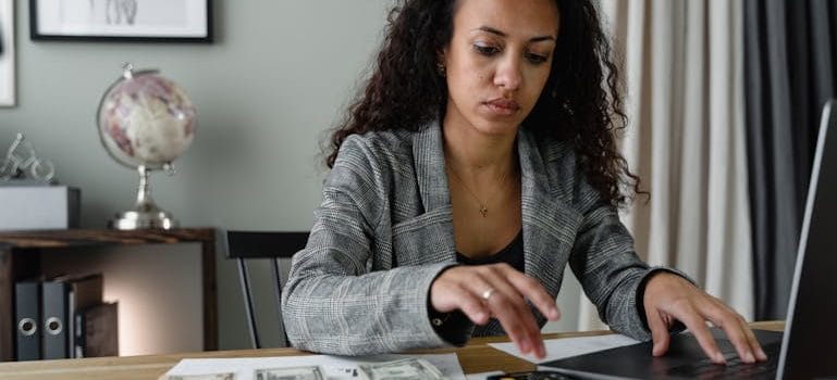  woman calculating to Move Out of the House After a Divorce