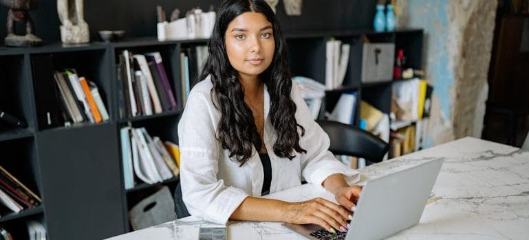 A Woman Using Laptop at the Office