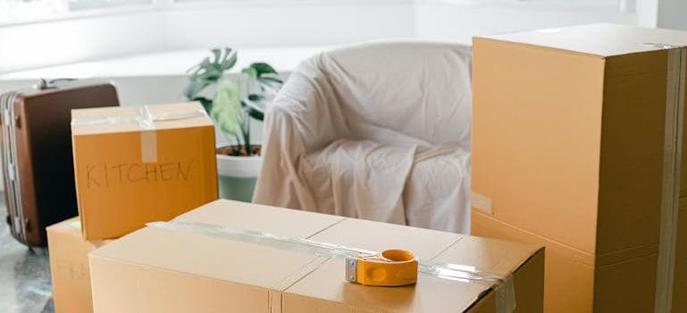 Empty apartment with packed carton boxes before moving