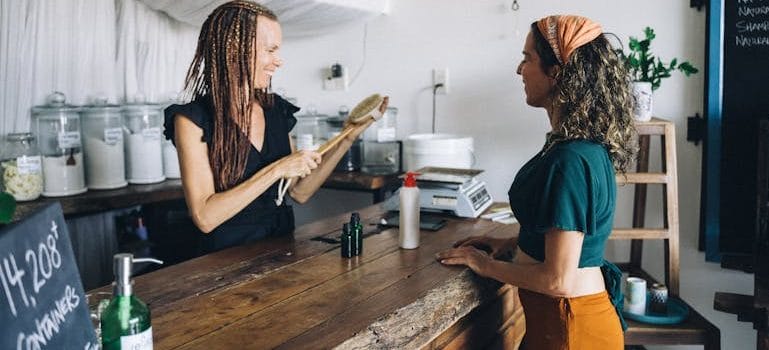 Seller and Customer in Wooden Counter