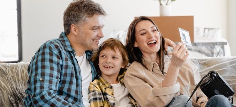 a family talking about how to make moving less traumatic for your kids