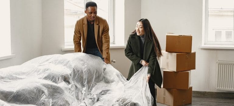 Man and Woman Unpacking in New Home