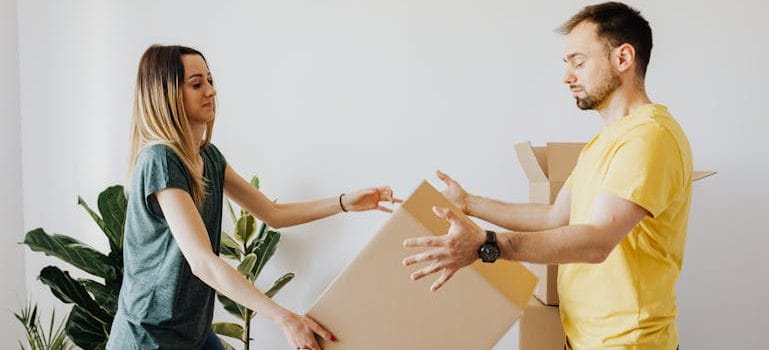 couple with packed carton boxes