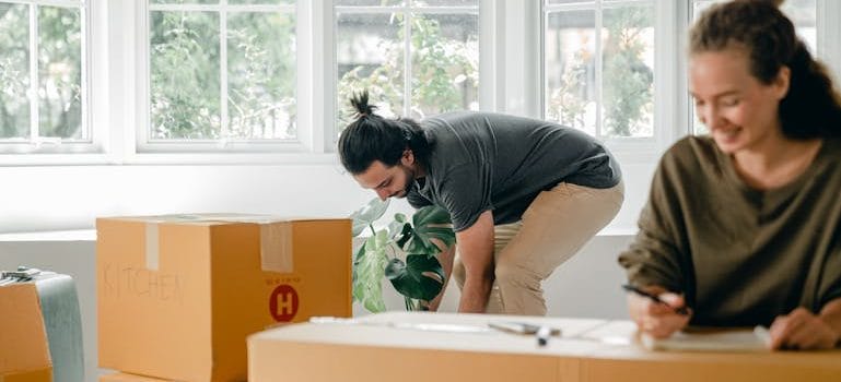 couple among boxes at new home
