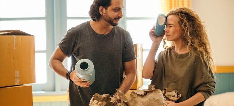 couple unpacking fragile things after relocation