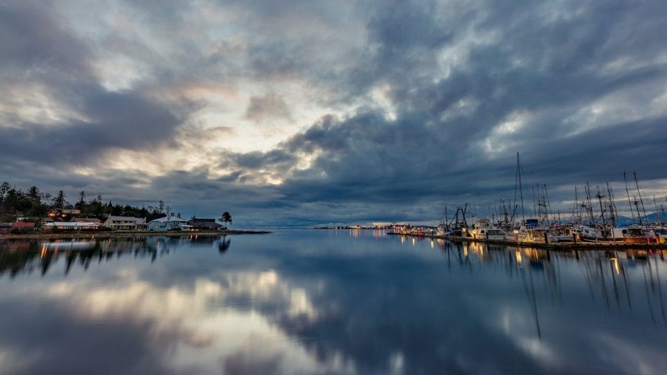 Body of Water Under Cloudy Sky