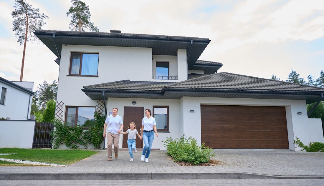 happy family outside their house