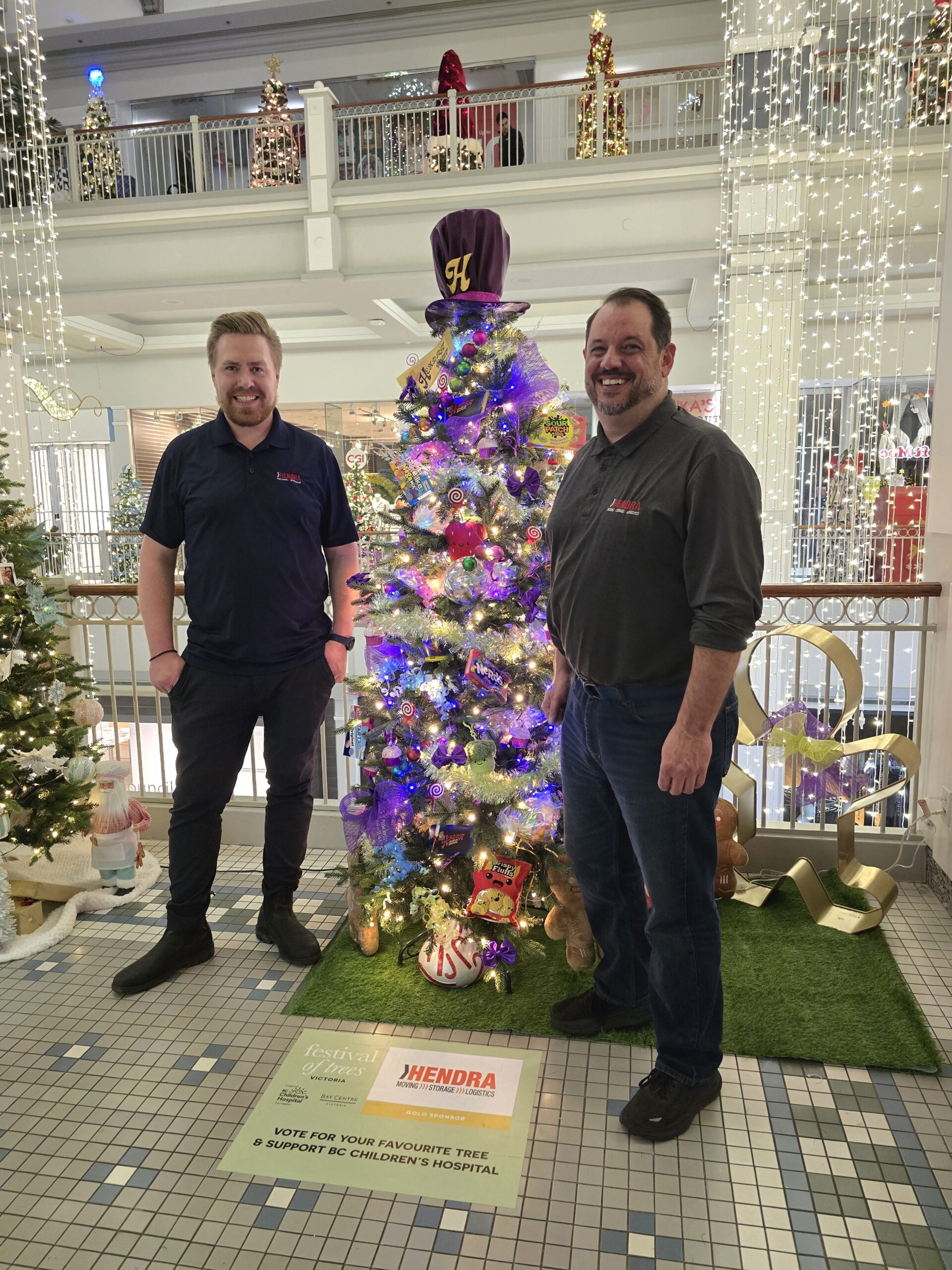 Hendra Moving, Storage & Logistics team decorating their Festival of Trees display in support of BC Children’s Hospital Foundation.